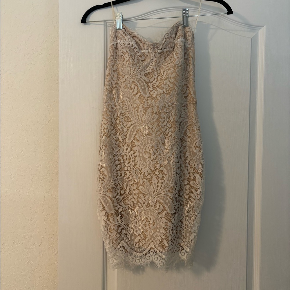 Super down cream mini dress with white lace. Size Medium but fits more like sm